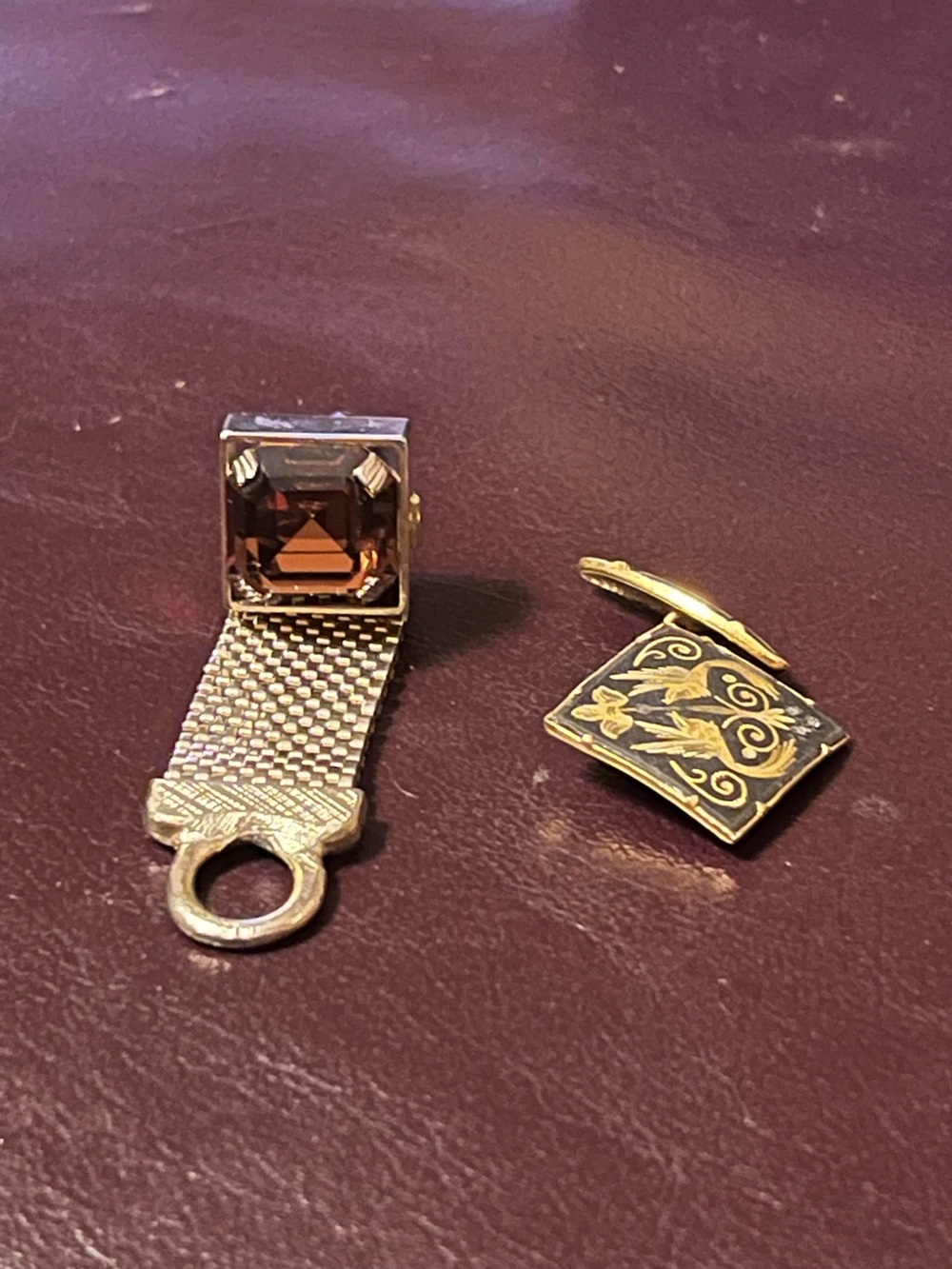 Two single cuff links Damascene and gold mesh with faux smoky quartz